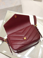 YSL quilted leather bag in burgundy, front with button closure and gold hardware