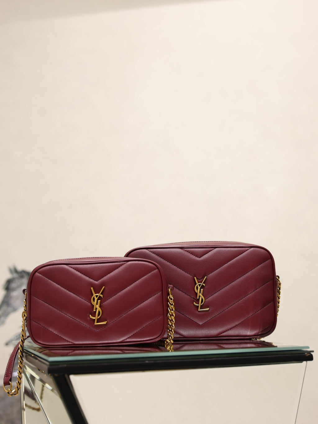YSL quilted shoulder bag with YSL logo and gold chain, burgundy