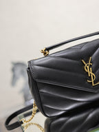 Black quilted flap shoulder bag with gold YSL logo and chain strap