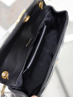 Black bag interior with pocket and visible lining seam detail