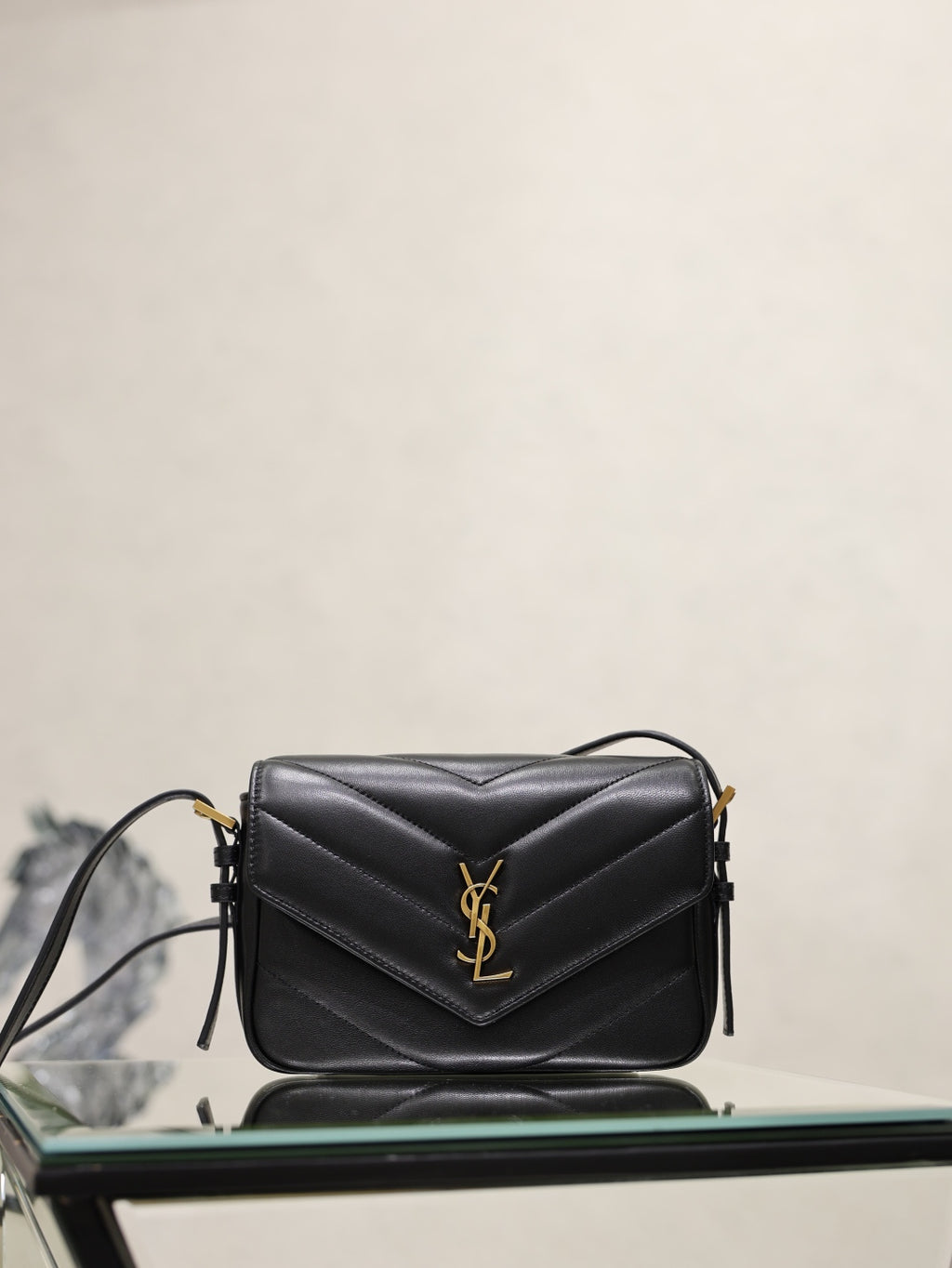 Black quilted YSL shoulder bag with gold logo, front flap and chain strap