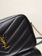 YSL quilted bag close-up, black leather with gold YSL monogram emblem