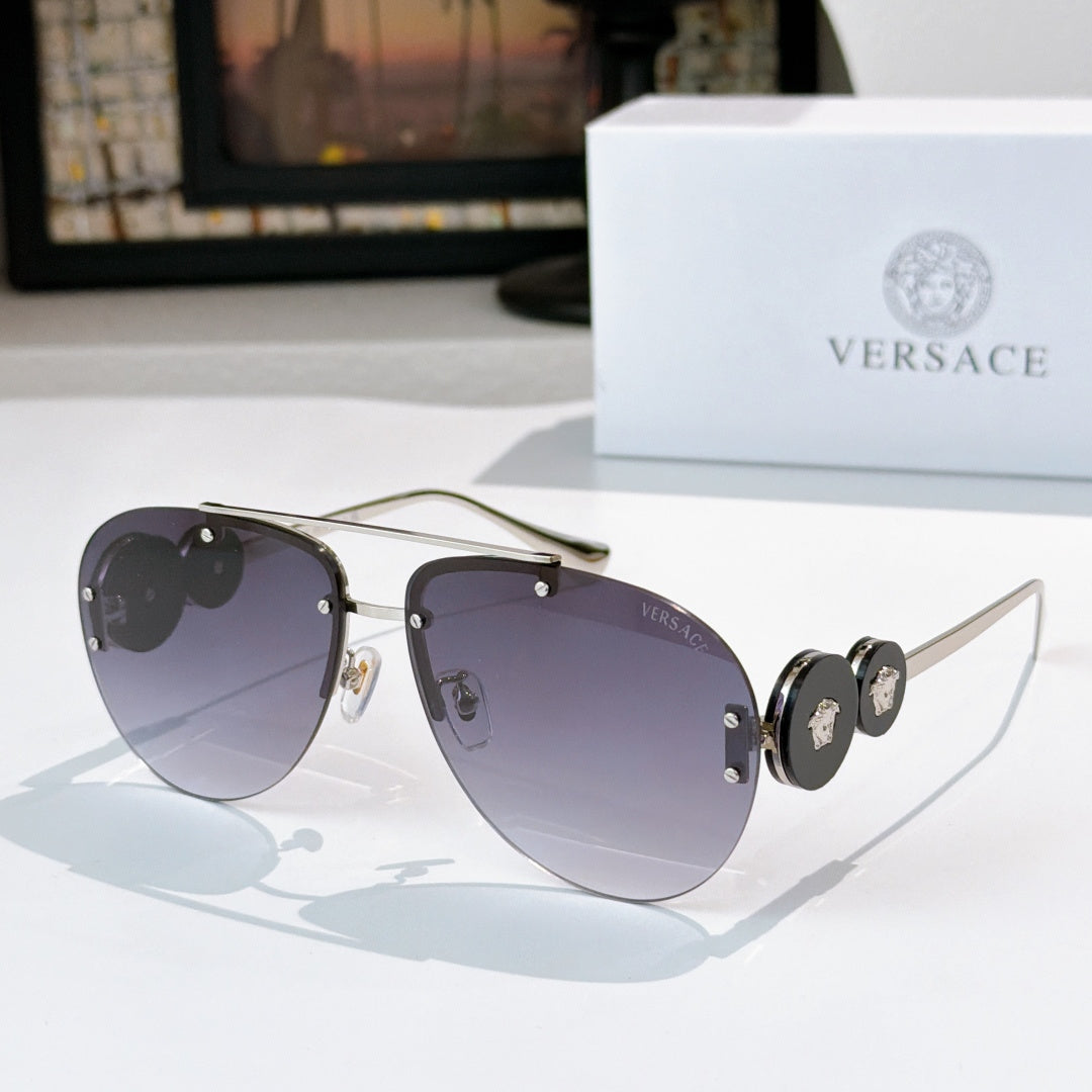 Metal-framed sunglasses with dark mirrored lenses and gold-tone temples