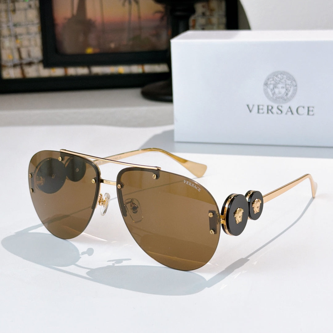 Metal-framed sunglasses with olive-brown tinted lenses and gold-tone temples