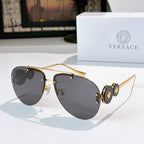 Metal-framed sunglasses with gray tinted lenses and gold-tone temples