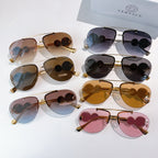 Assorted metal-framed sunglasses with tinted lenses in multiple colors