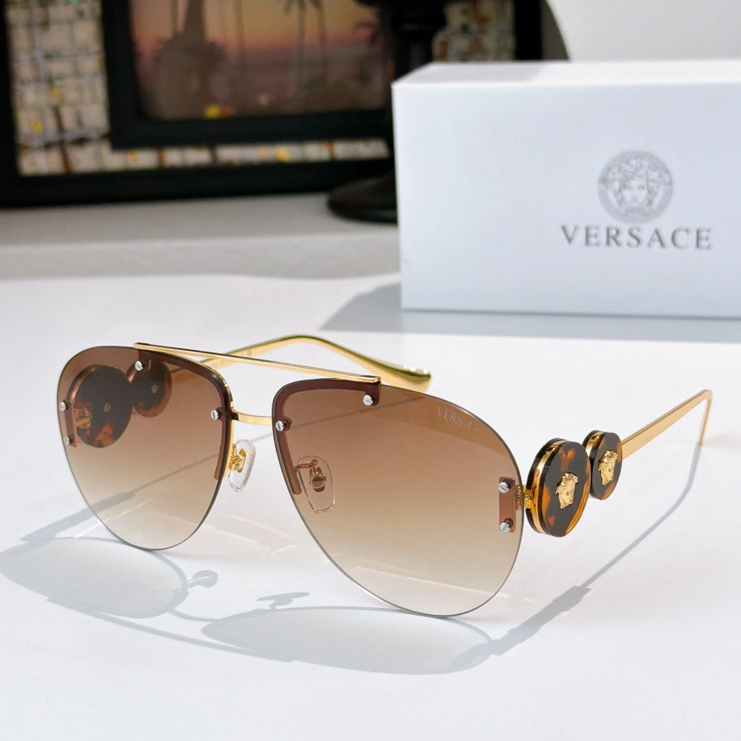 Metal-framed sunglasses with warm brown mirrored lenses and gold-tone temples