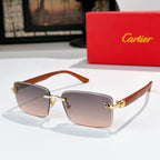 Sunglasses with taupe lenses, warm brown frame, gold hinges