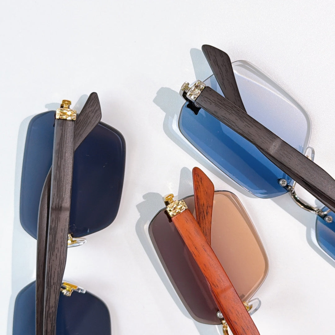 Cartier sunglasses assortment with wood-tone frames and blue and brown lenses