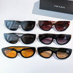 Prada sunglasses collection with multiple frames and tinted lenses