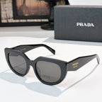 Prada sunglasses with dark frame and gray lenses, cat-eye style