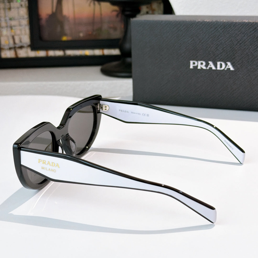 Prada sunglasses side view with dark frame and gray lenses, full temples