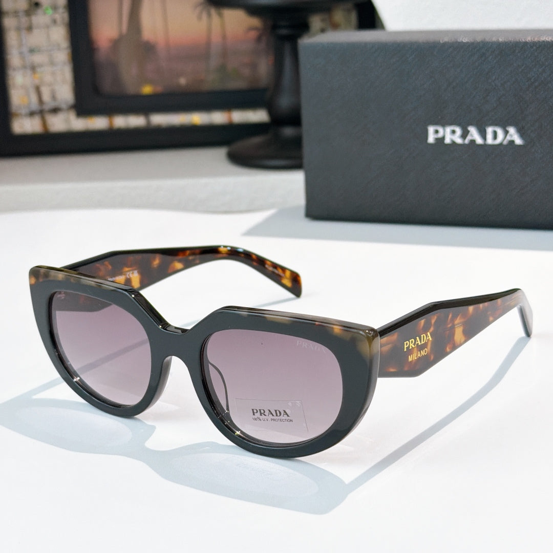 Prada sunglasses with dark frame, tortoise brow, and purple-tinted lenses