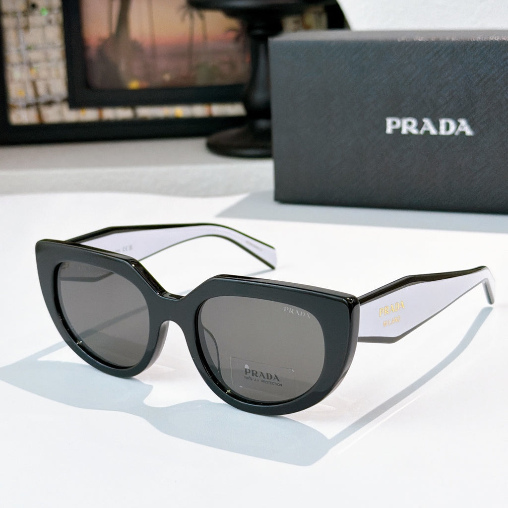 Prada sunglasses with dark frame and gray lenses, pale green temple arms