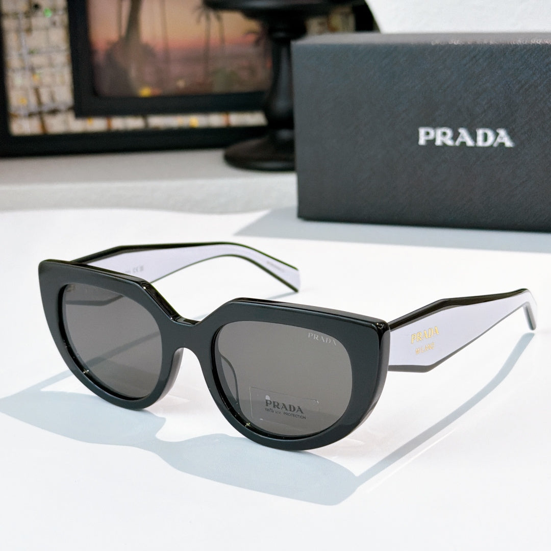 Prada sunglasses with dark frame and gray lenses, pale green temple arms