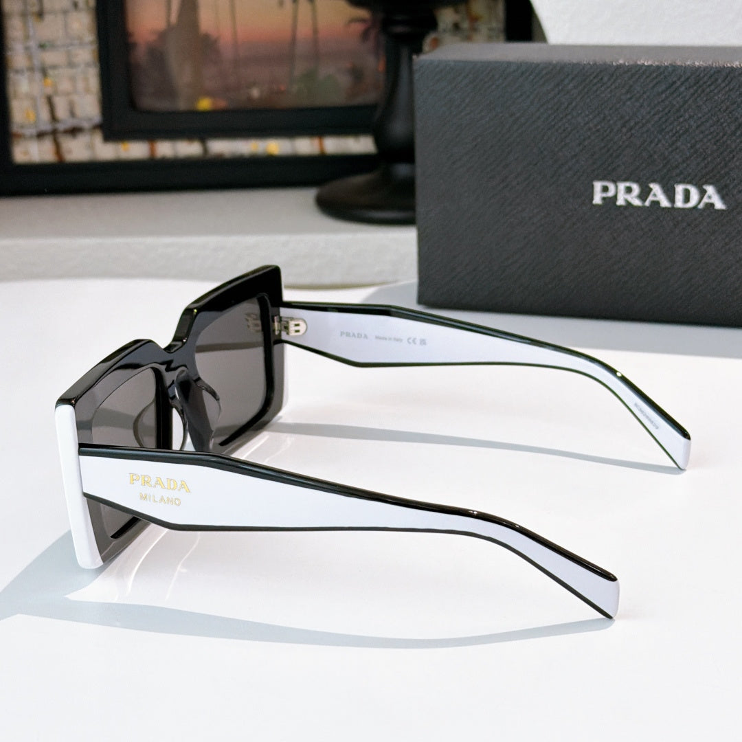 Prada rectangular sunglasses side view with black frame and tinted lens