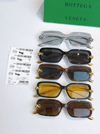 Set of four glasses with silver, dark, brown, and yellow frames and lenses