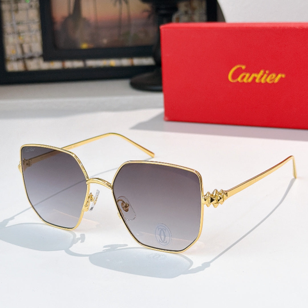 Designer glasses with gold-tone frames and gray tinted lenses