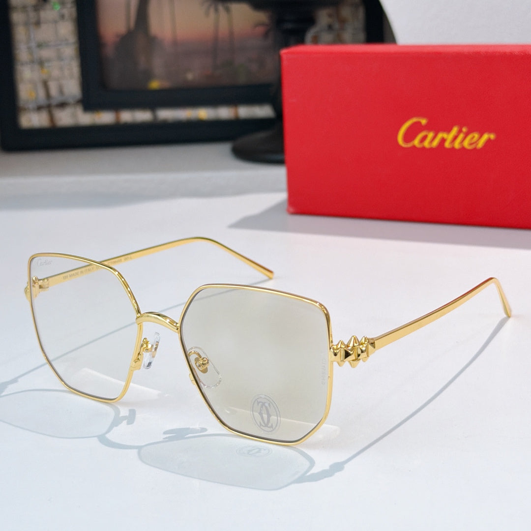 Cartier glasses with gold-tone frames and clear lenses, butterfly-shaped design