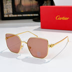 Designer glasses with gold-tone frames and blush-pink tinted lenses