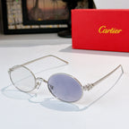 Cartier glasses: gold round frames with blue-tinted lenses