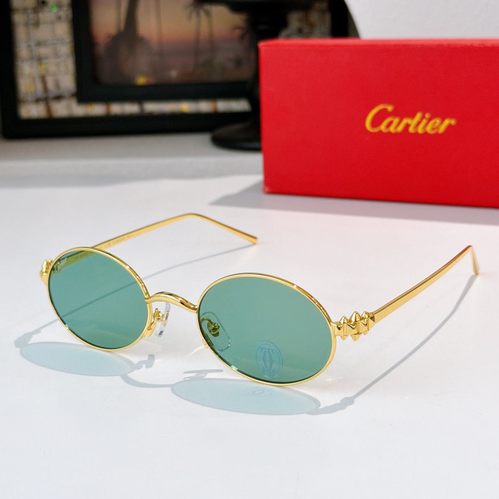 Cartier glasses: gold round frames with teal-tinted lenses
