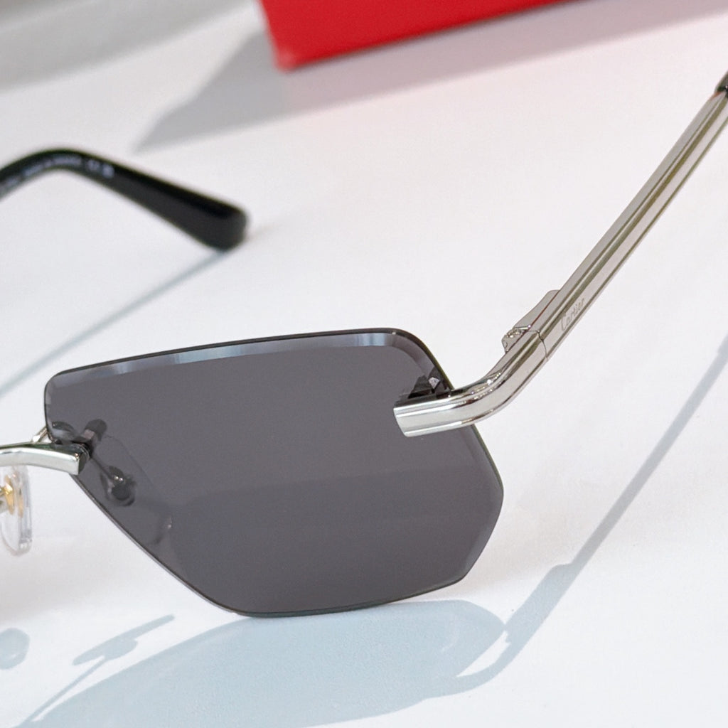Cartier glasses close-up: gold temple and dark gray lenses