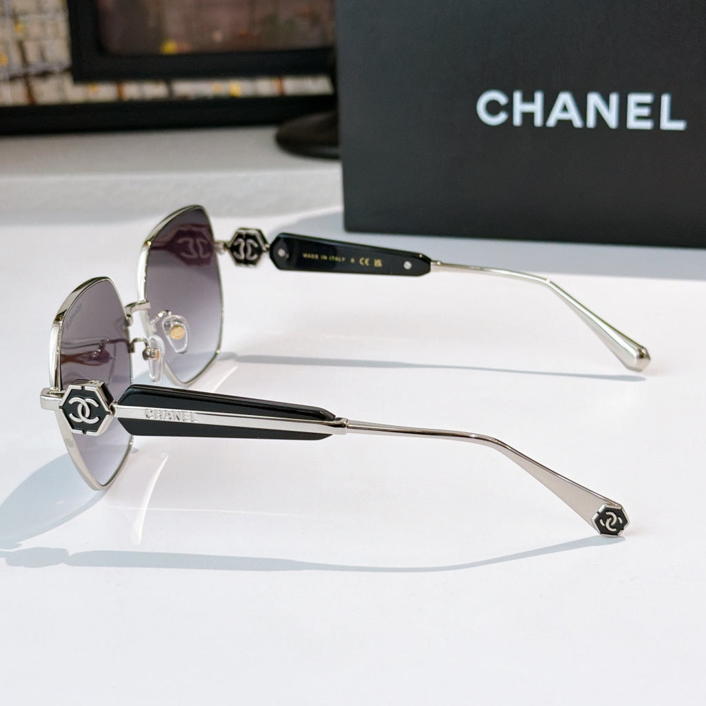 Chanel silver-tone sunglasses with purple tinted lenses and logo temple details