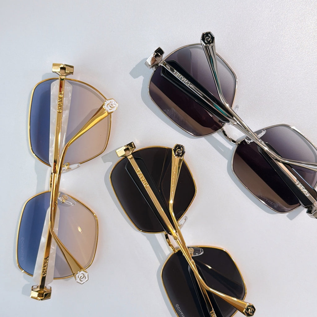 Chanel sunglasses set with mixed gold and black frames, tinted lenses (4 pairs shown)