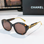 Chanel tortoiseshell sunglasses with round frames and brown-tinted lenses