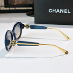 Chanel round sunglasses with blue frames and gold-toned arms