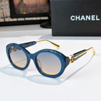 Chanel blue sunglasses with round frames and light tan-tinted lenses