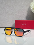 Prada black square sunglasses with orange mirrored lenses, with red Prada case behind
