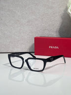 Prada eyeglasses with black frame and dark blue temples, rectangular clear lenses