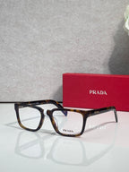 Prada dark tortoise and black rectangular eyeglasses with clear lenses