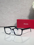 Prada black rectangular eyeglasses with white bridge detail and clear lenses