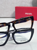 Prada eyeglasses with tortoiseshell upper frame and black lower frame