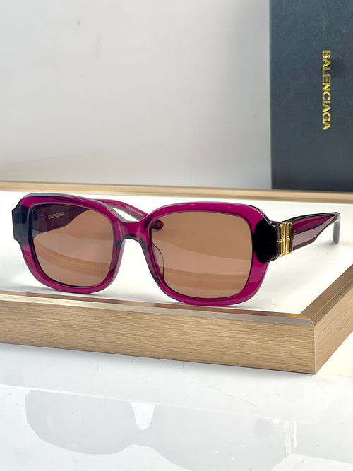 Square-frame sunglasses with purple frames and tan lenses, gold-tone hinges