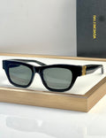 Blue acetate sunglasses with square lenses and gold-tone temple detail.
