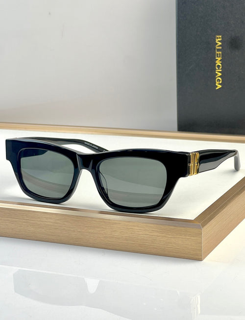 Blue acetate sunglasses with square lenses and gold-tone temple detail.