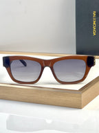 Brown tortoise acetate sunglasses with square lenses and gold-tone hinge detail.
