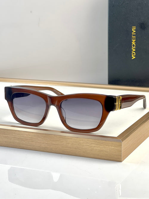 Brown tortoise acetate sunglasses with square lenses and gold-tone temple detail.
