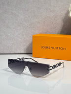Louis Vuitton sunglasses with dark tinted lenses and silver-tone chain temples