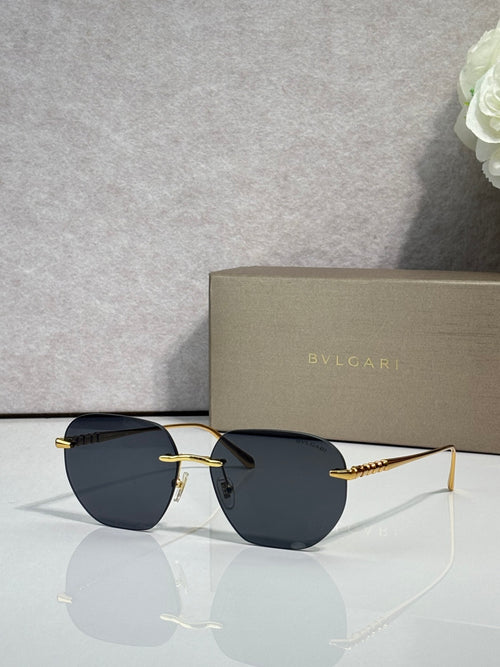 Gold metal round sunglasses with dark lenses and black temples, thin frame.