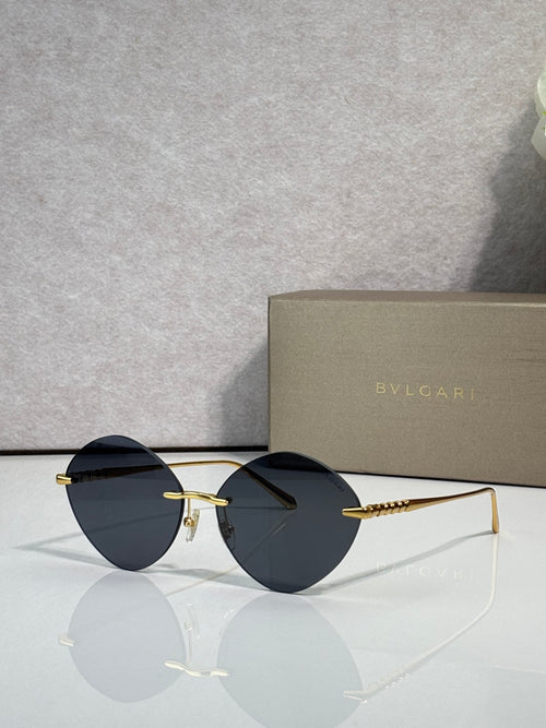 Round dark sunglasses with gold-tone frame and black lenses