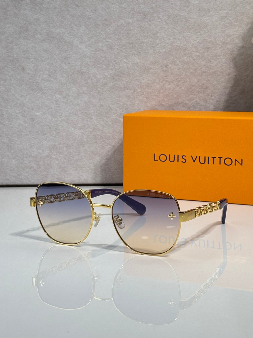 Louis Vuitton gold-tone sunglasses with purple gradient lenses