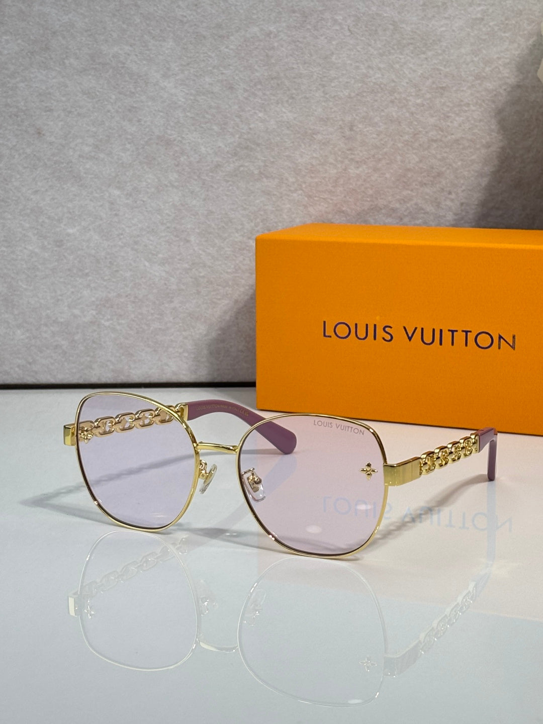 Louis Vuitton gold-tone sunglasses with light pink gradient lenses