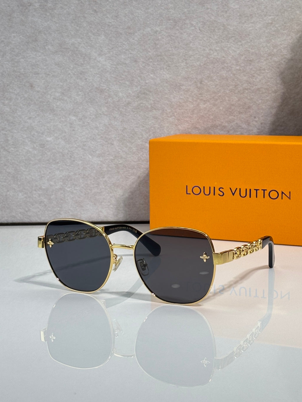 Louis Vuitton gold-tone sunglasses with dark blue gradient lenses