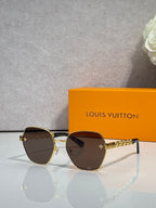 Louis Vuitton sunglasses with gold-tone frame, dark tinted lenses, logo temple details