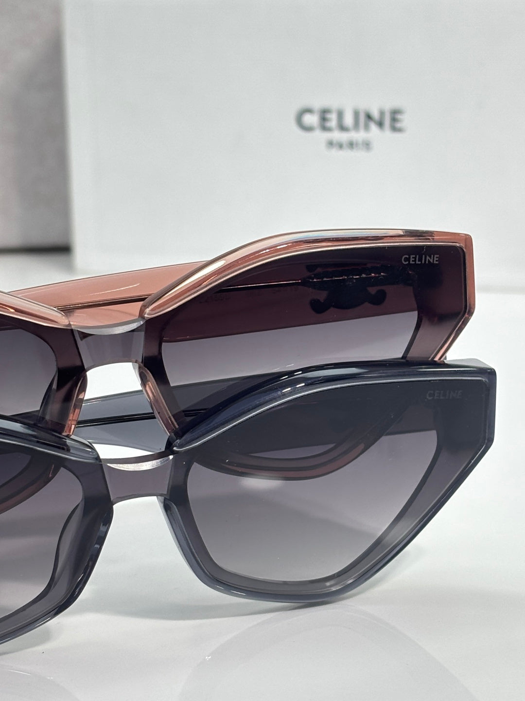 Celine cat-eye sunglasses close-up with rose-tinted bridge and dark lenses